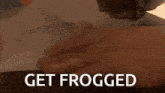 a person is holding a piece of paper that says get frogged on it