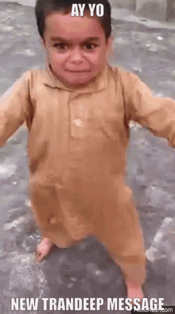 a little boy is standing in the water with the words ay yo new trandeep message below him .