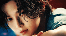 a close up of a woman with wet hair
