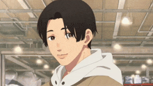 a young man in a brown jacket and white hoodie is smiling