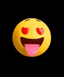 a yellow smiley face with red heart shaped eyes sticking out its tongue