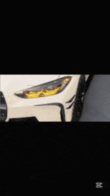 a white car is driving down a road with a black background and the word capcut at the bottom