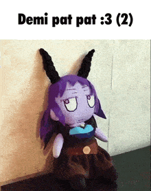 a stuffed animal with horns and the words demi pat pat : 3 ( 2 ) above it