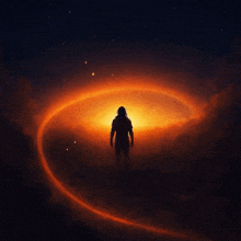 a silhouette of a person standing in front of a large orange light