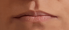 a close up of a woman 's lips with a slight wrinkle .