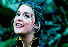 a close up of a woman 's face smiling