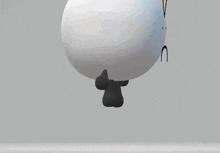 a 3d rendering of a white object with black feet and a face .