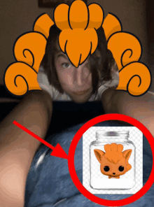a person laying on a bed with a funko pop in a jar behind them