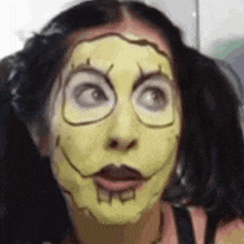 a woman with a spongebob mask on her face