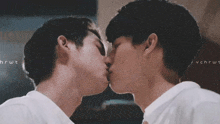 a couple of men kissing with the letters hrwt on the bottom