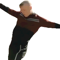 a man in a red and black shirt and black pants is standing with his arms outstretched