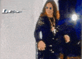 a blurred image of a man with a cross around his neck and the word lee in the corner