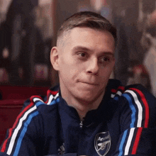 leandro trossard arsenal trying not to laugh really