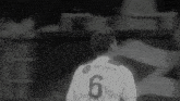 a soccer player wearing a jersey with the number 6 on it