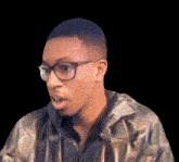 a man wearing glasses and a camo jacket is making a surprised face