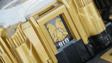 a close up of a gold building with the number 916 on it
