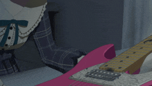 a girl with gray hair is playing a pink guitar
