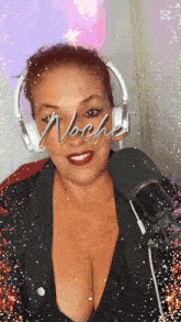 a woman wearing headphones and a microphone has the word noche on her face
