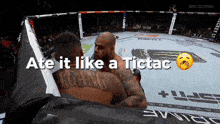 two men in a boxing ring with the words " ate it like a tictac " above them