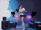 a woman is standing in front of a dj table