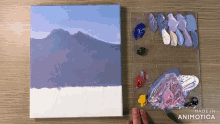 a painting is being painted on a canvas with the words made in animotica above it