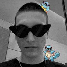 a man wearing sunglasses with squirtle on his head