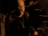 a person with a blue light coming out of their mouth is standing next to stairs