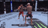 two men are fighting in a boxing ring with a bud light banner on the wall
