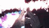 a close up of a person 's hands with flames coming out of it