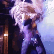 a person is standing on a stage with a smoke coming out of their mouth