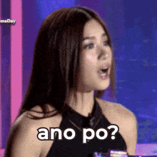 a woman is making a funny face with the words ano po written on her face