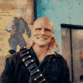 a man wearing a mask and a gun belt stands in front of a sign that says " that fits a gun fits "