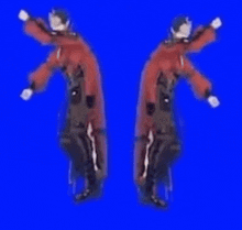a man in a red cape is dancing in front of a blue screen .