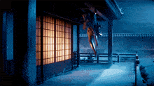a person is hanging upside down from a building