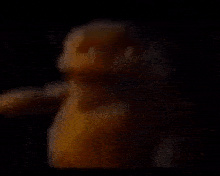 a close up of a yellow object in the dark