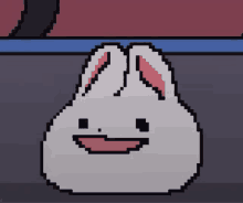 a pixel art drawing of a white bunny with a smile on its face