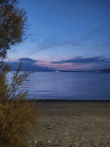 a view of a body of water with mountains in the background