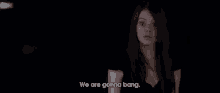 a woman with long red hair says we are gonna bang in a dark room .