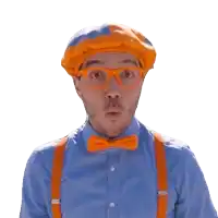 a man in a blue shirt and orange suspenders is wearing an orange hat and glasses and making a surprised face .