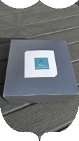 a black and white photo of a cake and a box that says briseu