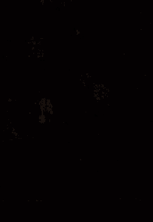 a person is standing in front of a bus stop at night .