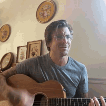 strumming anthony green cameo playing guitar smiling