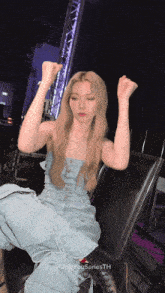 a woman in a blue dress is sitting on a chair with her arms in the air and the words only you series th on the bottom