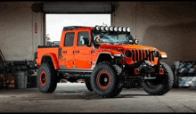 an orange jeep is parked in a garage with a lot of lights on the roof