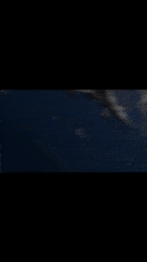 a blurry picture of a person 's face with a black background