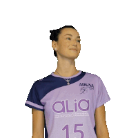 a woman in a purple shirt with the number 15 on it
