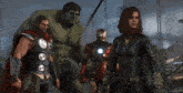 hulk thor iron man and black widow are standing together