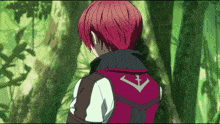 a person with red hair and a red vest with a cross on the back