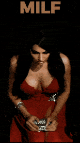a woman in a red dress is on a poster that says ' milf ' on it