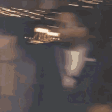 a man wearing sunglasses is giving the middle finger .